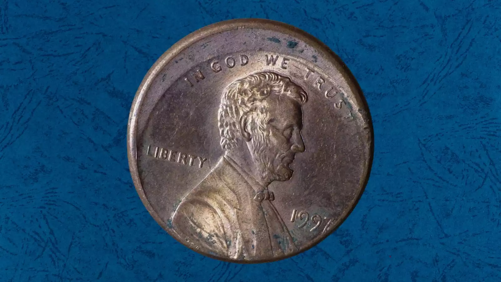 1997 off-center struck penny showing design shifted 30-40% with visible blank planchet crescent