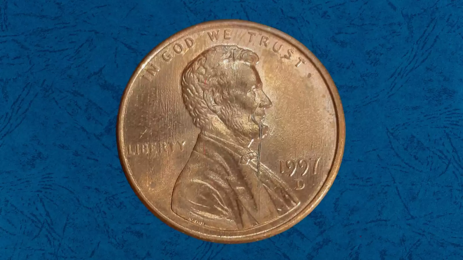 1997 die crack penny showing a raised line running across the coin surface from a fractured working die